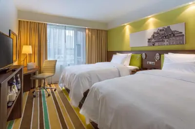 Łóżko lub łóżka w pokoju w obiekcie Hampton by Hilton Warsaw City Centre