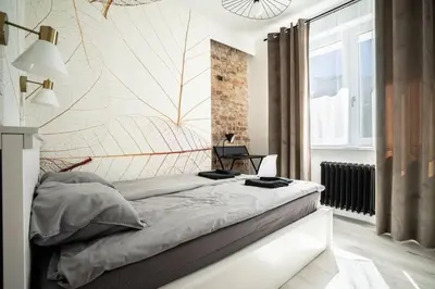 Łóżko lub łóżka w pokoju w obiekcie Apartment Marszalkowska Premium Warsaw City Center