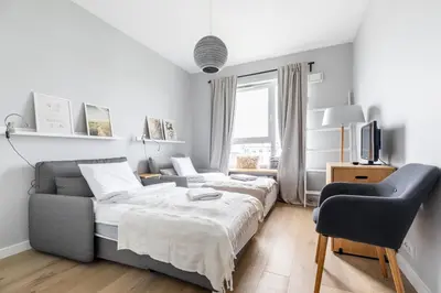 Łóżko lub łóżka w pokoju w obiekcie P&O Apartments Rembrandta - Targówek