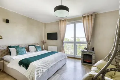 Łóżko lub łóżka w pokoju w obiekcie Palladium Elektoralna Apartments