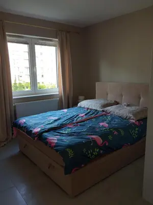 Łóżko lub łóżka w pokoju w obiekcie Złoty apartament Bokserska