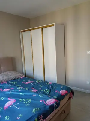 Łóżko lub łóżka w pokoju w obiekcie Złoty apartament Bokserska