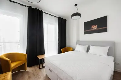 Łóżko lub łóżka w pokoju w obiekcie New Varsovia Comfort 346 by BookingHost
