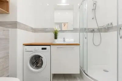 Łazienka w obiekcie Beautfiul Warsaw Apartment for Families with AC by Noclegi Renters