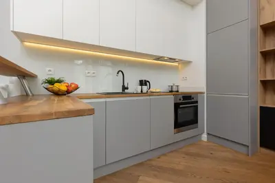 Kuchnia lub aneks kuchenny w obiekcie Beautfiul Warsaw Apartment for Families with AC by Noclegi Renters