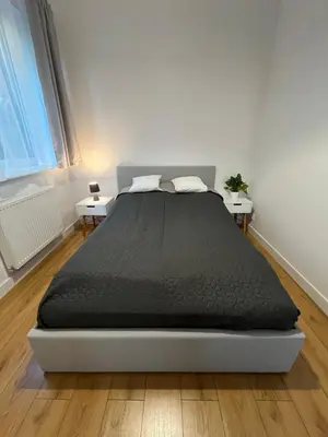 Łóżko lub łóżka w pokoju w obiekcie R HOUSE - brand new apartments with patio and garage