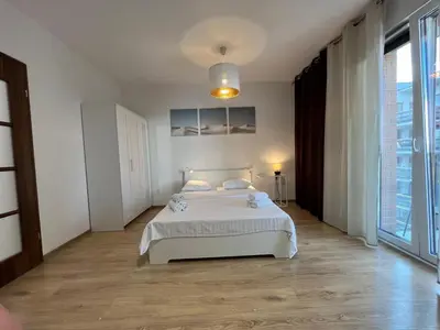 Łóżko lub łóżka w pokoju w obiekcie Studio Okrzei Praga