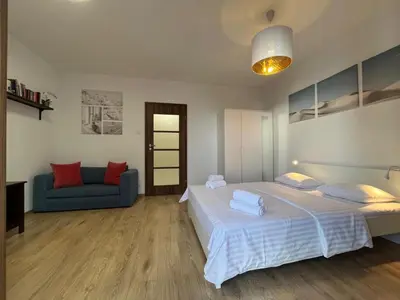 Łóżko lub łóżka w pokoju w obiekcie Studio Okrzei Praga