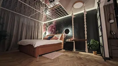 Łóżko lub łóżka w pokoju w obiekcie Secret Garden Apartment