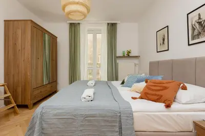 Łóżko lub łóżka w pokoju w obiekcie Tasteful Apartment in Warsaw City Center by Noclegi Renters