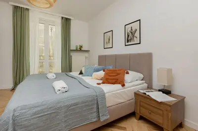 Łóżko lub łóżka w pokoju w obiekcie Tasteful Apartment in Warsaw City Center by Noclegi Renters