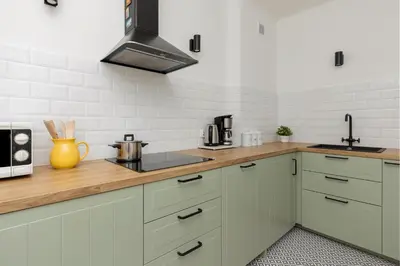 Kuchnia lub aneks kuchenny w obiekcie Tasteful Apartment in Warsaw City Center by Noclegi Renters