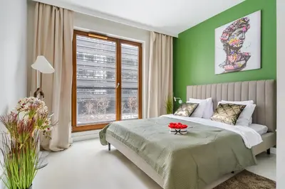 Łóżko lub łóżka w pokoju w obiekcie Lumina Deluxe Warsaw