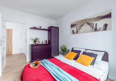 Łóżko lub łóżka w pokoju w obiekcie SuperApart Habicha apt74 - Ursus z balkonem