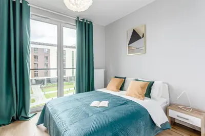 Łóżko lub łóżka w pokoju w obiekcie Praga Residence Premium