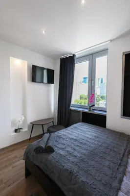 Łóżko lub łóżka w pokoju w obiekcie ClickTheFlat Chłodna Center Apart Rooms