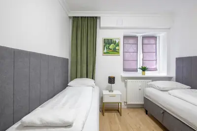 Łóżko lub łóżka w pokoju w obiekcie Labo Apartment Sady Żoliborskie