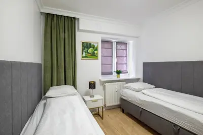 Łóżko lub łóżka w pokoju w obiekcie Labo Apartment Sady Żoliborskie