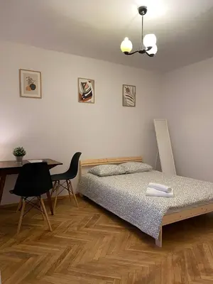 Łóżko lub łóżka w pokoju w obiekcie HALBY rooms Pańska 55