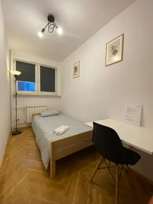 Łóżko lub łóżka w pokoju w obiekcie HALBY rooms Pańska 55