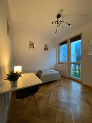 Łóżko lub łóżka w pokoju w obiekcie HALBY rooms Pańska 55