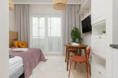 Łóżko lub łóżka w pokoju w obiekcie Wola Business Studios Kasprzaka by Noclegi Renters