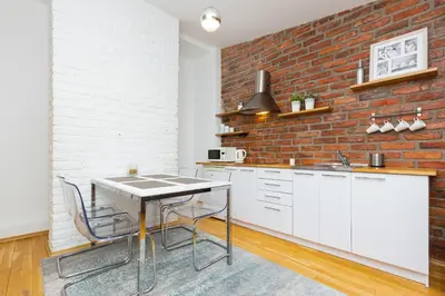 Kuchnia lub aneks kuchenny w obiekcie Warsaw City Centre Apartment Poznanska with Air-Conditioning by Noclegi Renters