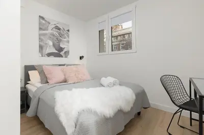 Łóżko lub łóżka w pokoju w obiekcie Cosy Dream City Center Apartment by Noclegi Renters