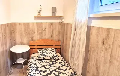 Łóżko lub łóżka w pokoju w obiekcie Zlota Sliska Pokoje Centrum