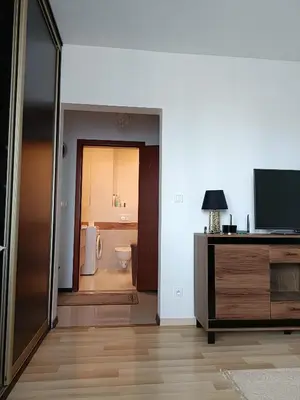 Łóżko lub łóżka w pokoju w obiekcie Apartament Paderewskiego 1