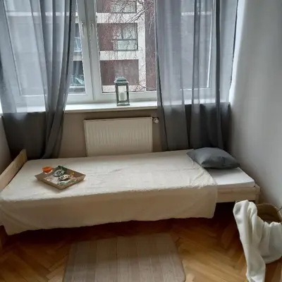 Łóżko lub łóżka w pokoju w obiekcie Regem Pokoje Złota
