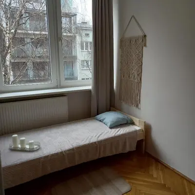 Łóżko lub łóżka w pokoju w obiekcie Regem Pokoje Złota