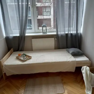 Łóżko lub łóżka w pokoju w obiekcie Regem Pokoje Złota