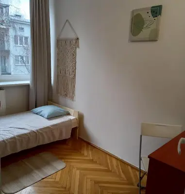 Łóżko lub łóżka w pokoju w obiekcie Regem Pokoje Złota