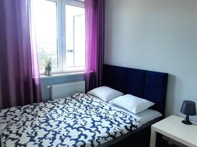 Łóżko lub łóżka w pokoju w obiekcie Apartament Wawa