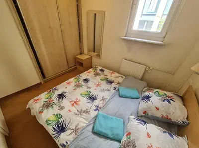 Łóżko lub łóżka w pokoju w obiekcie 10Q - Z6 Apartment 305