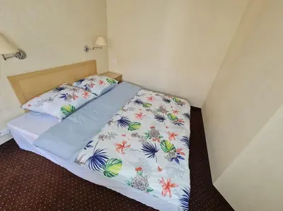 Łóżko lub łóżka w pokoju w obiekcie 10Q - Z6 Apartment 201