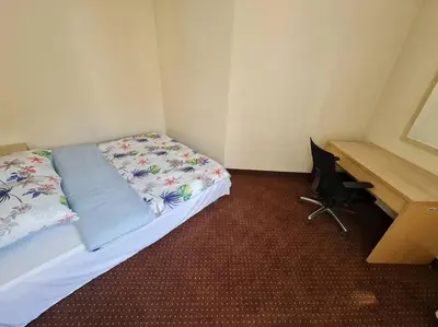 Łóżko lub łóżka w pokoju w obiekcie 10Q - Z6 Apartment 201