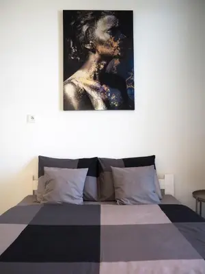 Łóżko lub łóżka w pokoju w obiekcie EastApart A83