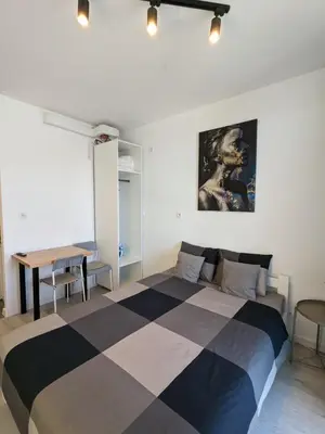Łóżko lub łóżka w pokoju w obiekcie West Modern City Apartments