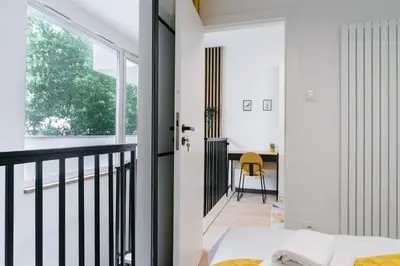 Łóżko lub łóżka w pokoju w obiekcie City Break P&O Apartments Olbrachta - Wola