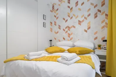 Łóżko lub łóżka w pokoju w obiekcie City Break P&O Apartments Olbrachta - Wola