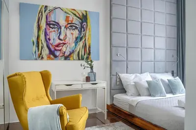 Łóżko lub łóżka w pokoju w obiekcie Corolla Apartments Pod Palmą - Nowy Świat