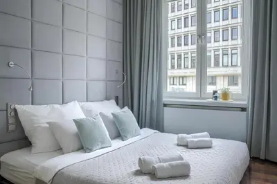 Łóżko lub łóżka w pokoju w obiekcie Corolla Apartments Pod Palmą - Nowy Świat
