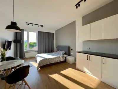 Łóżko lub łóżka w pokoju w obiekcie K22 Slawinska 503 Sun-City Apart Warsaw