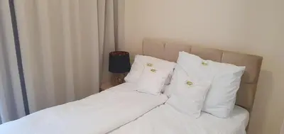 Łóżko lub łóżka w pokoju w obiekcie Apartament VARSOVIA 403
