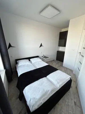 Łóżko lub łóżka w pokoju w obiekcie Stay Apartment