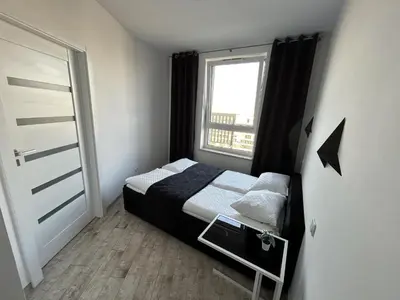 Łóżko lub łóżka w pokoju w obiekcie Stay Apartment