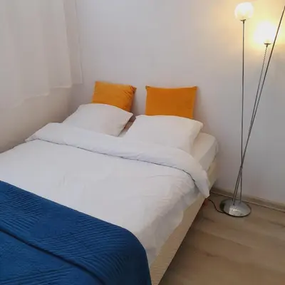 Łóżko lub łóżka w pokoju w obiekcie Apartament Park Saski