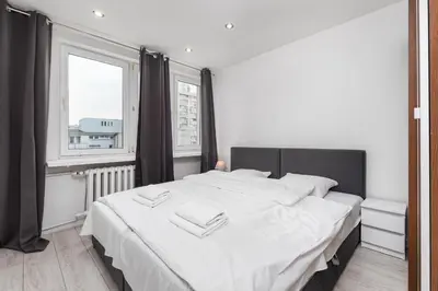 Łóżko lub łóżka w pokoju w obiekcie Apartamenty Pańska by Your Freedom